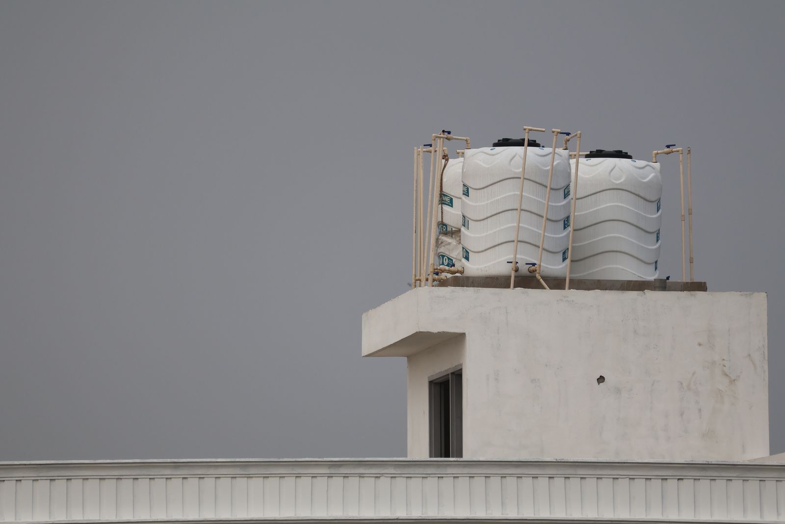 White water tanks on a rooftop, ready for cleaning and sanitising